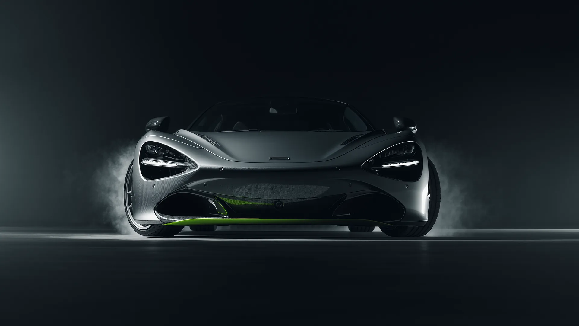 Performance car under heavy braking with the nose dipped and brake discs glowing