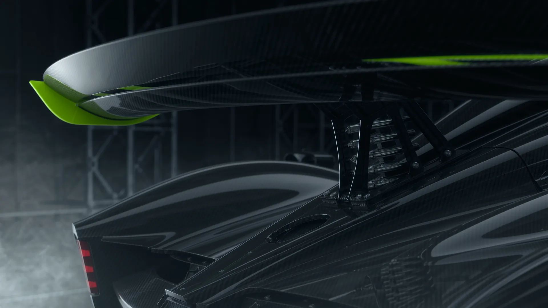 Active rear wing of a supercar tilting between its low drag and high downforce positions