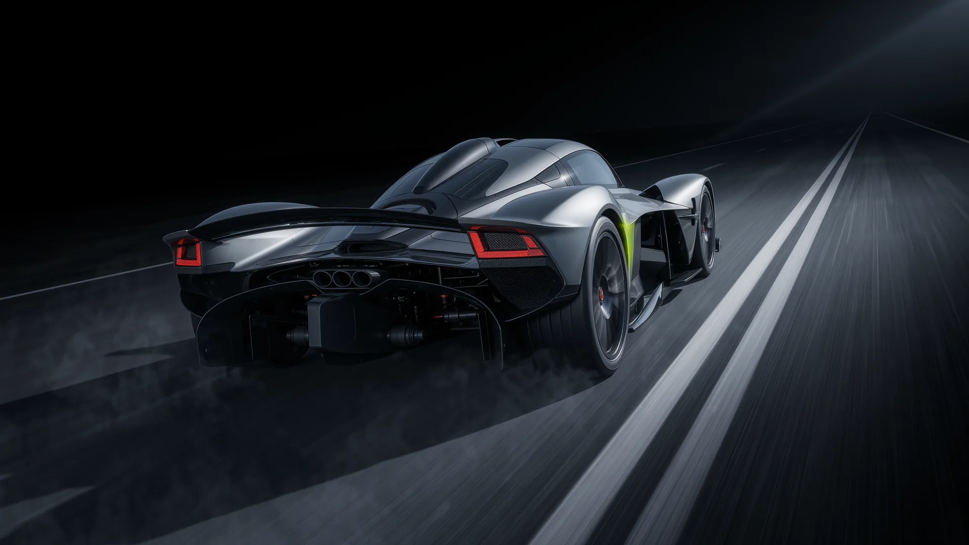 Hypercar at extreme speed on a proving ground straight with heat haze around the bodywork